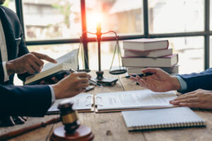 Lawyer and justice concept Discussion between male lawyer and client, giving advice and proceeding with financial legal matters. Close up image.