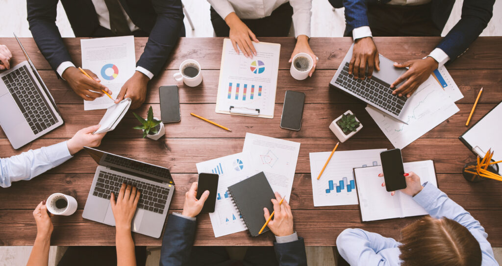 Meeting of business team working with gadgets and documents